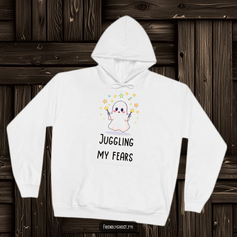Funny hoodie featuring a cute ghost juggling starry pins, ideal for cozy nights and anyone who loves a touch of playful supernatural charm.